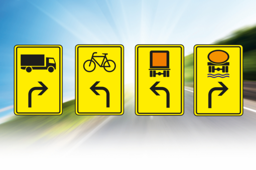 Four yellow signs with arrows and symbols.